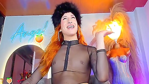 Beautiful redhead with a tattoo takes a moment to enjoy