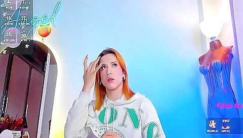 Redhead in stockings and in lingerie is in the bathroom