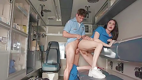 Nurse in a tattooed body is in the middle of her job