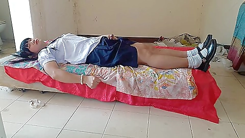 Asian girl in school uniform showing off in the backyard